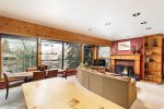 Floor-to-ceiling windows and wood-burning fireplace